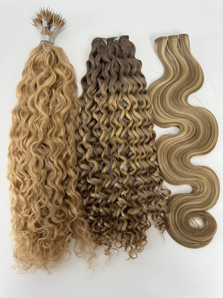 Three hair bundles showing tight curls and loose waves