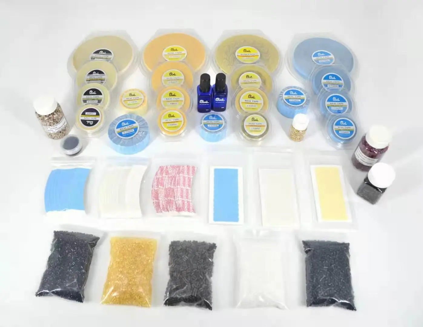 Assortment of extension tapes, beads and application supplies